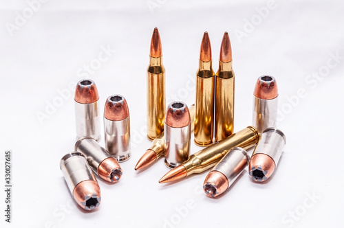 Wallpaper Mural Four different caliber bullets, 223 rifle bullets, 9mm, 40 caliber and 45 auto o