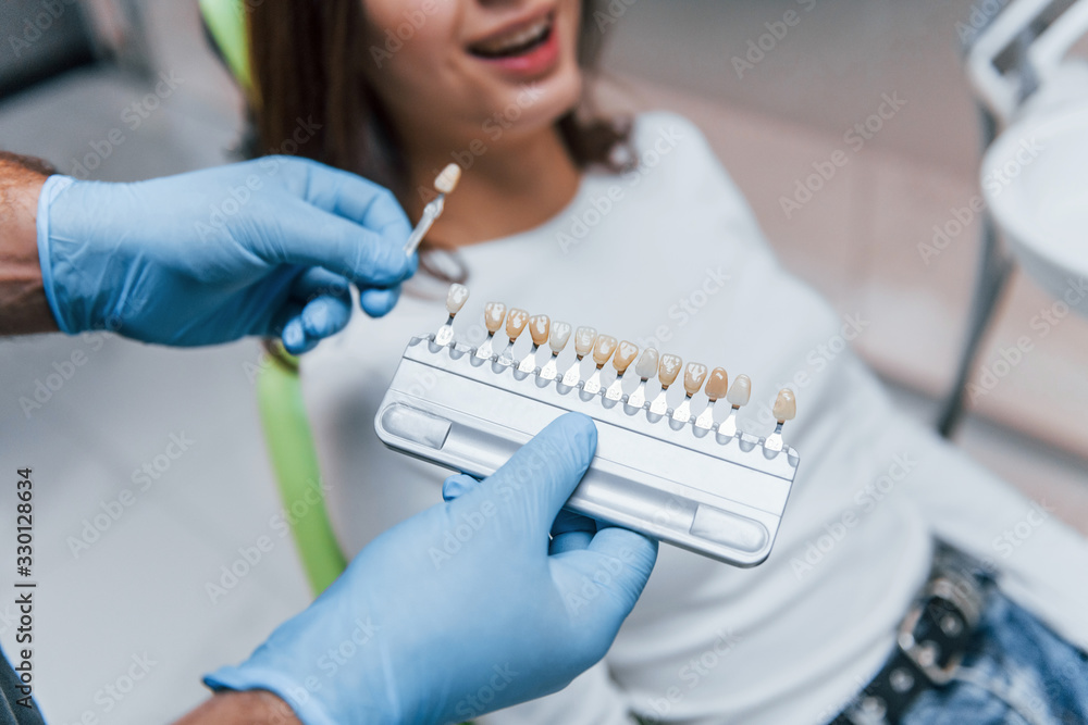 Young adult woman have a visit in the dentist clinic. Conception of stomatology Young adult woman have a visit in the dentist clinic. Conception of stomatology