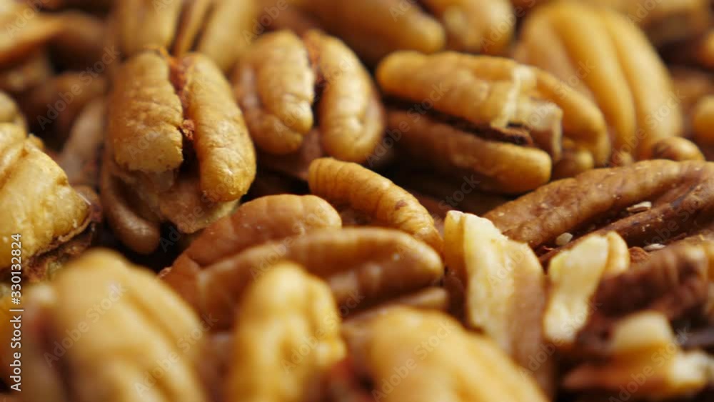 Pecan nuts background. Closeup pekan seeds. Rotate Pecan nuts background. Closeup pekan seeds. Rotate
