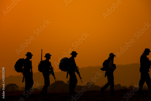 silhouettes of people on sunset background © VIEWFOTO STUDIO