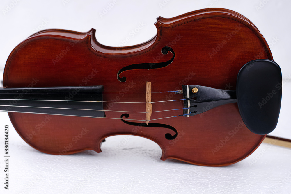 Front side of violin put on background,show detail of string instrument Front side of violin put on background,show detail of string instrument