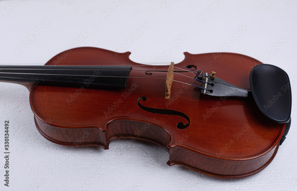 Fototapeta premium Violin put on background,show front side of string instrument