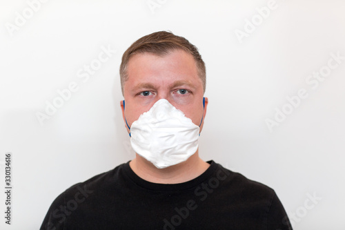 Young adult man in medical mask. Covid 2019 and other virus pneumonia infection concept.
