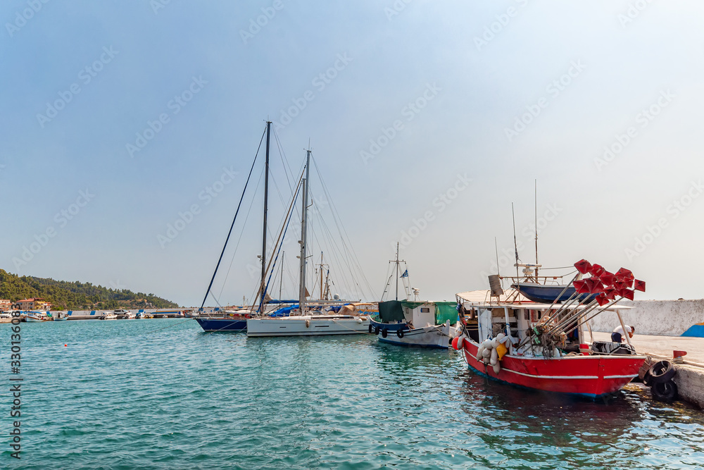 Nea Skioni, Greece - September 06, 2019: The Harbour entrance at Nea Skioni Kassandra, Chalkidiki, Central Macedonia, Greece. Greek marina with parked boats and yachts