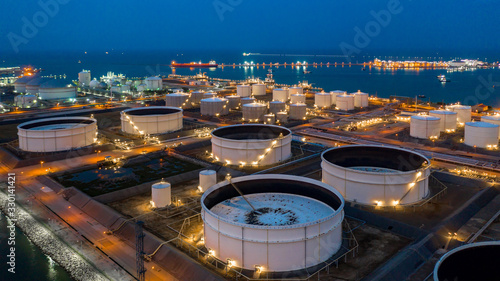 Aerial view oil and gas terminal storage tank farm,Tank farm storage chemical petroleum petrochemical refinery product, Business commercial trade fuel and energy transport by tanker vessel.