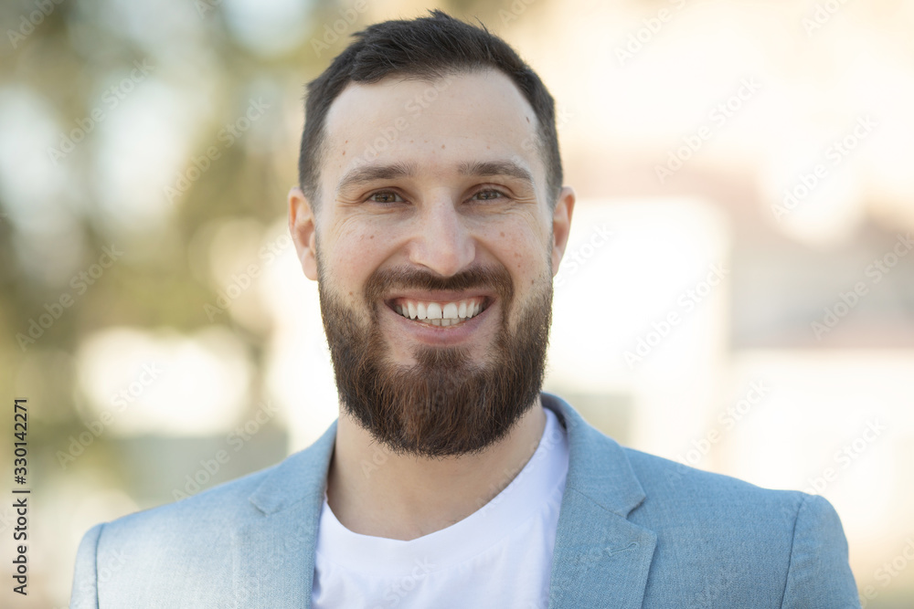 Cool handsome guy with beard smiling. Cool handsome guy with beard smiling.