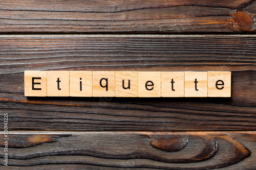 ETIQUETTE word written on wood block. ETIQUETTE text on wooden table for your desing, concept