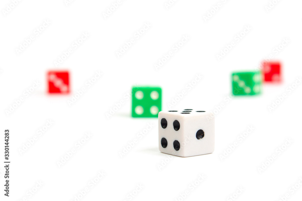 game dice scattered in white green and red on a white background isolate, side view game dice scattered in white green and red on a white background isolate, side view