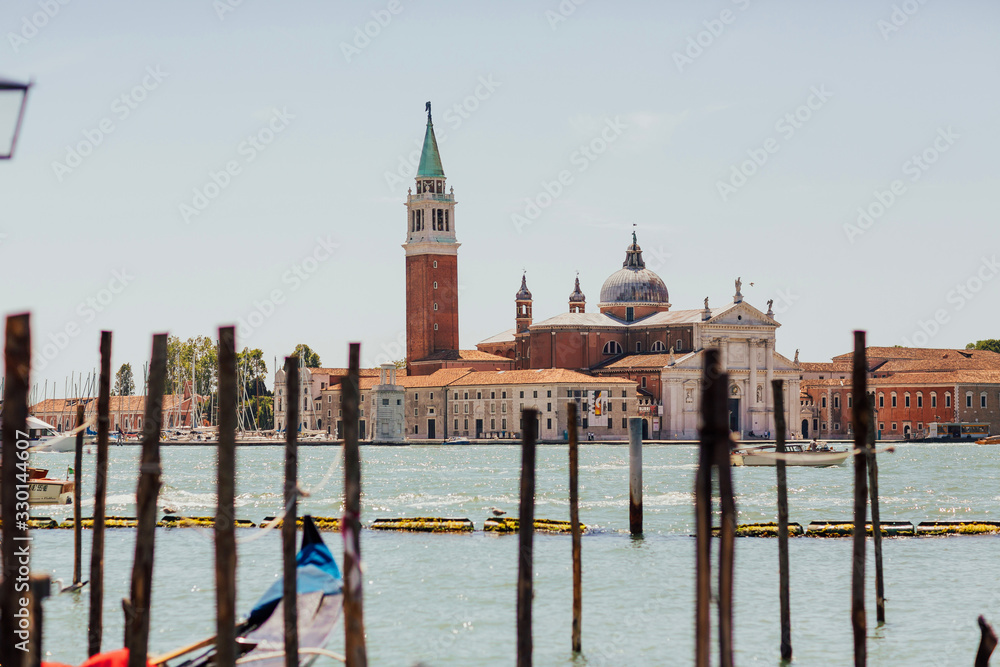 VENICE, ITALY JUNE 17, 019- View of San Giorgio Maggiore in Venice, Italy. Gondolas at Saint Mark's Square and church of San Giorgio Maggiore on background, Italy.  