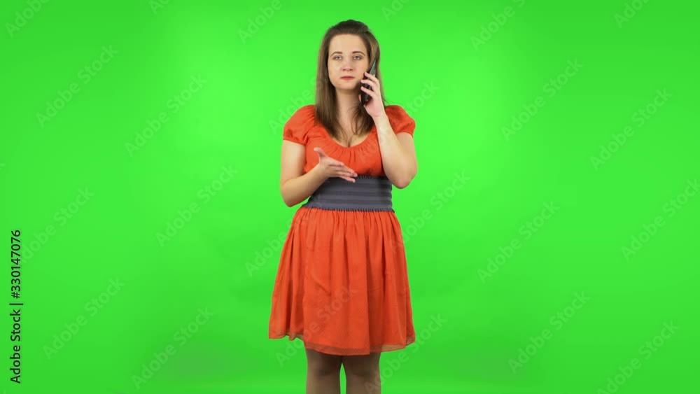 Cute girl angrily speaking on the phone, proving something . Green screen Cute girl angrily speaking on the phone, proving something . Green screen