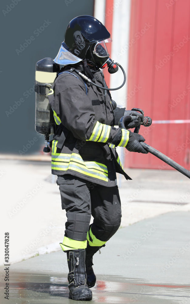 Naklejka premium firefighter with helmet and breathing system