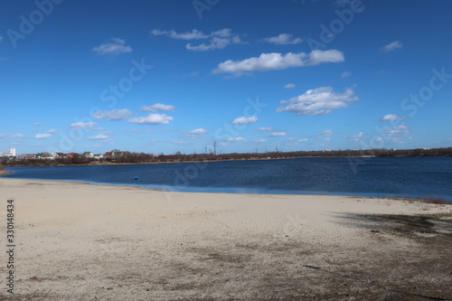Fototapeta Naklejka Na Ścianę i Meble -  a beautiful landscape with a blue sky combined with a blue river and white sand