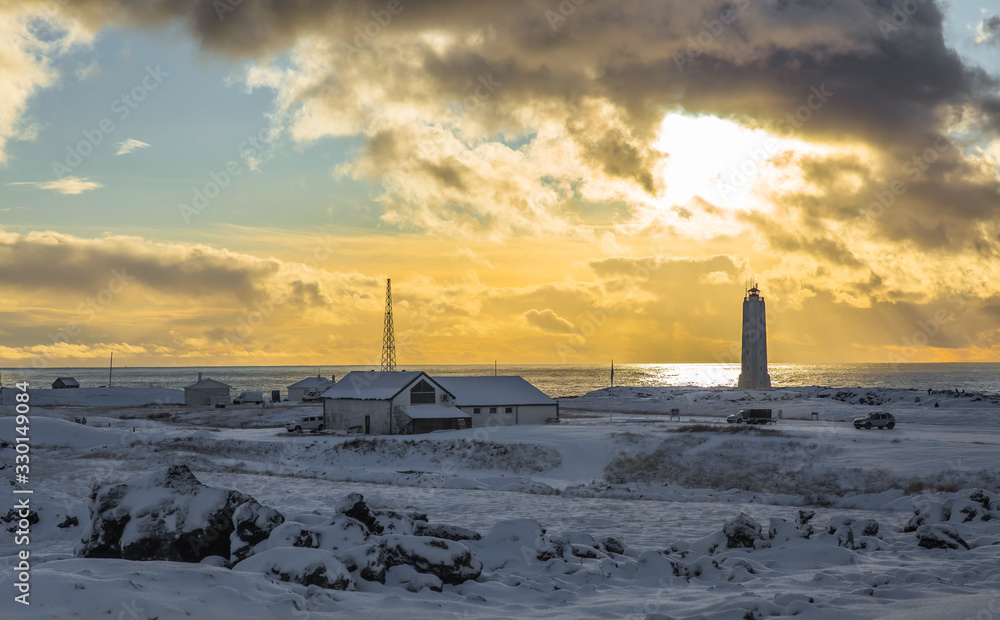 Fototapeta premium sunset on the lighthouse Iceland