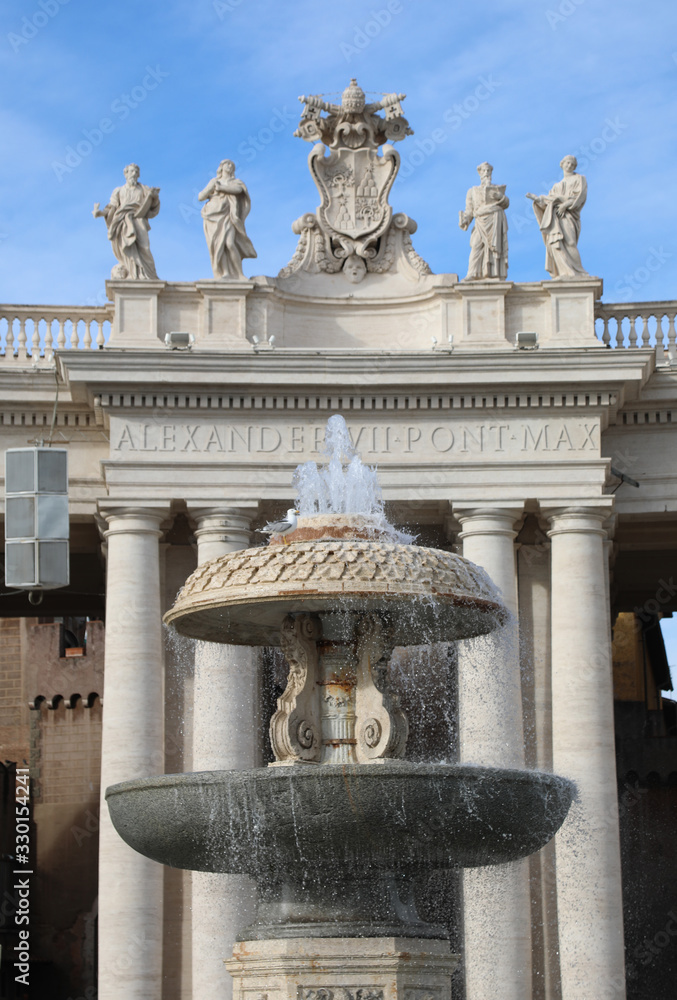 Ancient big Fountain in Saint Peter Square in Vatican City