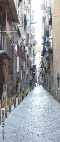Fototapeta narrow alley and the popular houses in the district of Naples i