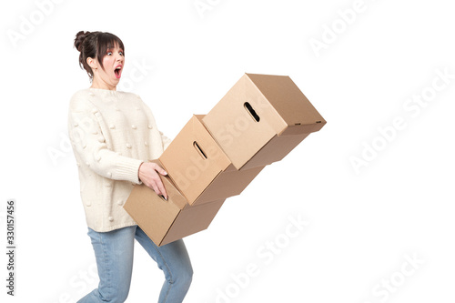 Woman drop a stack of boxes while delivery or moving. Clumsy postman or delivery man. © Galina_lya