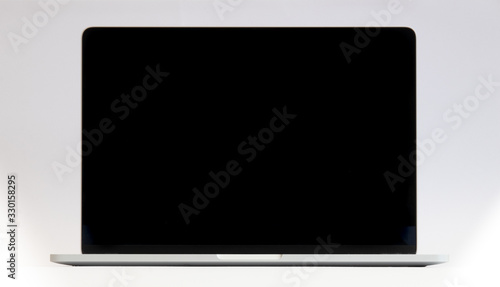 laptop computer in silver with black screen for use as a background