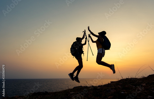 Two young Asian female hiking on mountain holiday, wild adventure. Background for Travel concept