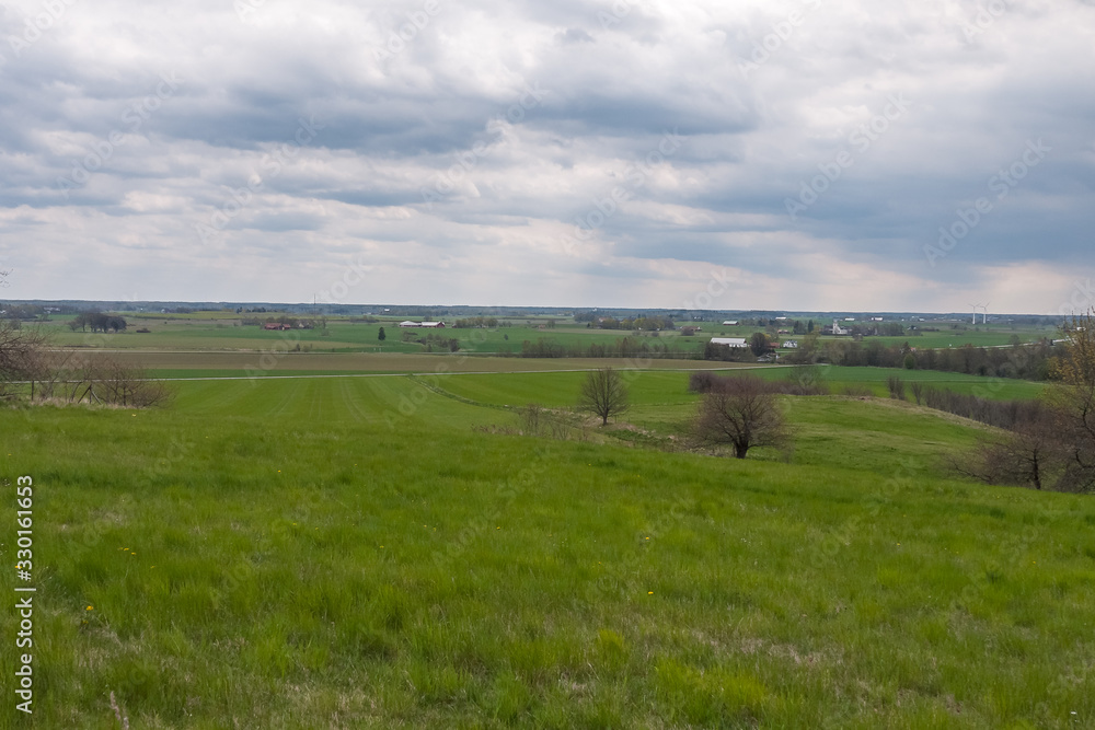 Spring Landscape with Wheat Field under Clouds in central Sweden