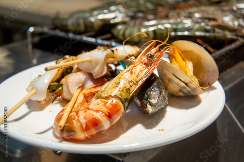  delicious grilled mixed seafood on plate