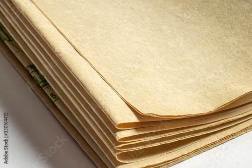 Old vintage paper documents on white background paper corners with free blank space and selective focus with depth of field. photo