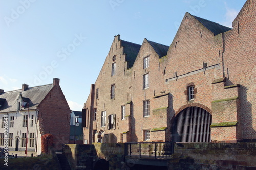 s   Hertogenmolens  large water mills on the river Demer in Aarschot  Belgium . Built around 1510. View from the east