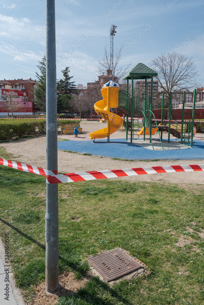 PALENCIA, SPAIN - MARCH 13, 2020: closed and empty children playgrounds in Spain because of coronavirus pandemic, covid-19, crisis PALENCIA, SPAIN - MARCH 13, 2020: closed and empty children playgrounds in Spain because of coronavirus pandemic, covid-19, crisis