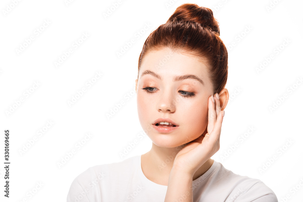 beautiful female teenager touching face with clean skin, isolated on white beautiful female teenager touching face with clean skin, isolated on white