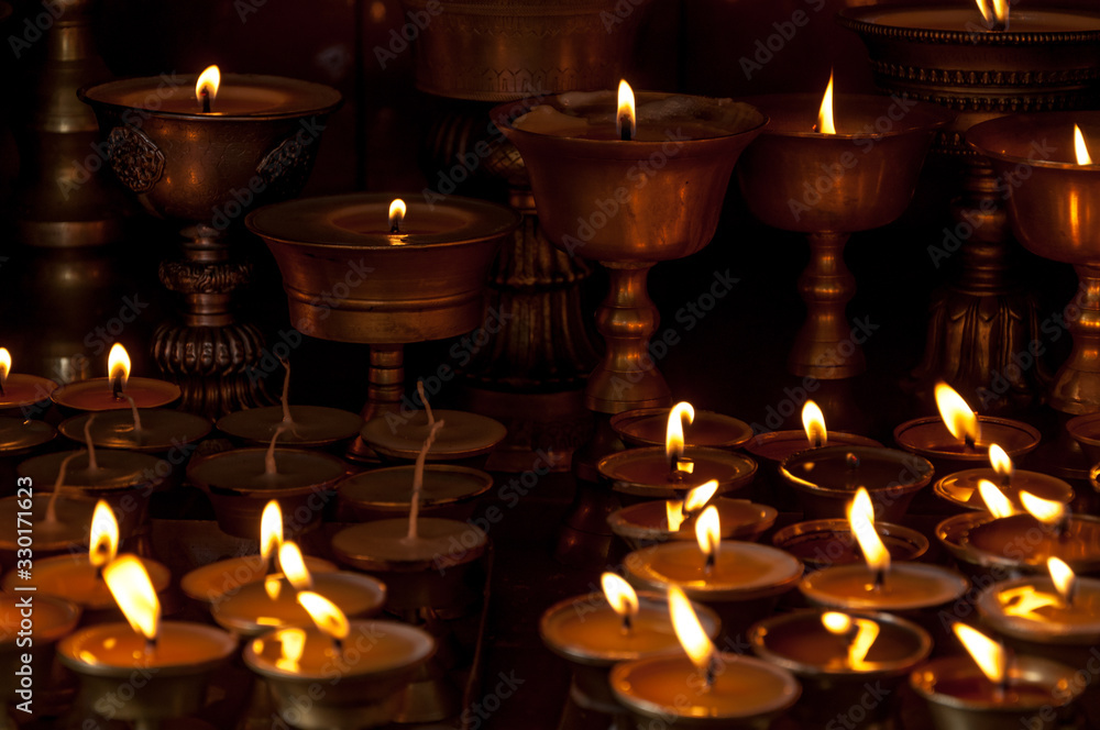 Lit candles at the monkey temple of Kathmandu Lit candles at the monkey temple of Kathmandu