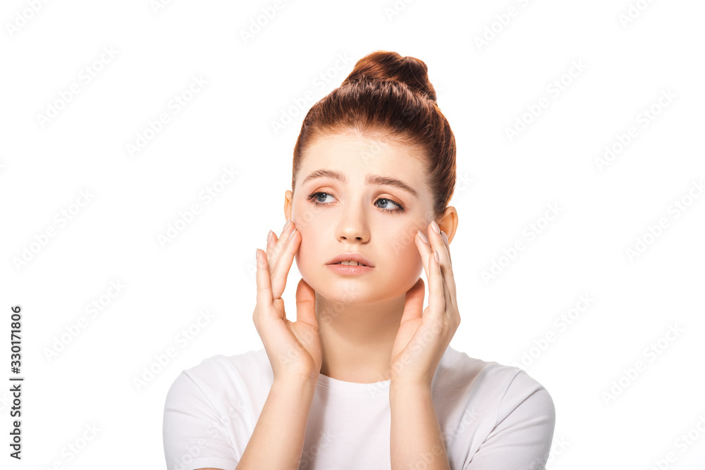 upset beautiful female teenager touching face, isolated on white upset beautiful female teenager touching face, isolated on white