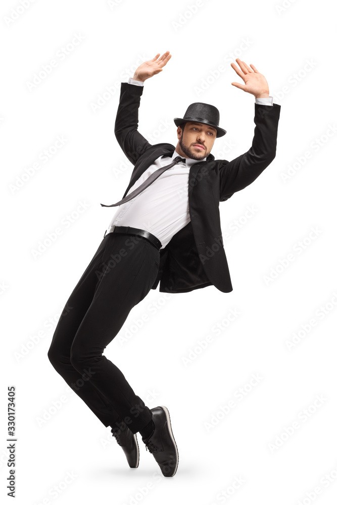 Man in a suit dancing on tiptoes