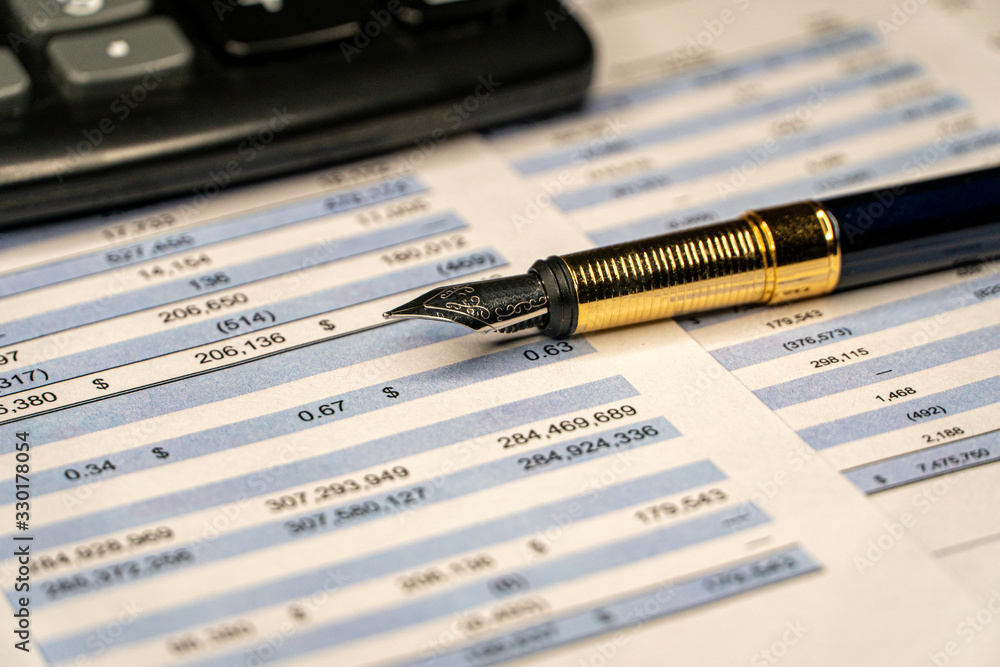 Calculator and the financial report. Financial accounting. Calculator and the financial report. Financial accounting.