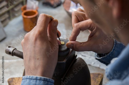 close-ups of goldsmith work in an artisan workshop in Toledo