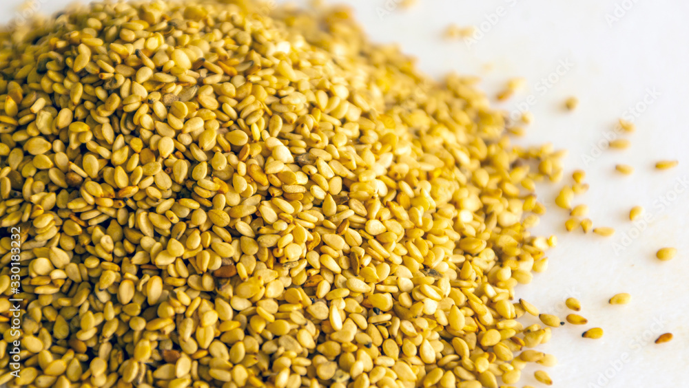 Many sesame seeds surrounded by white background Many sesame seeds surrounded by white background