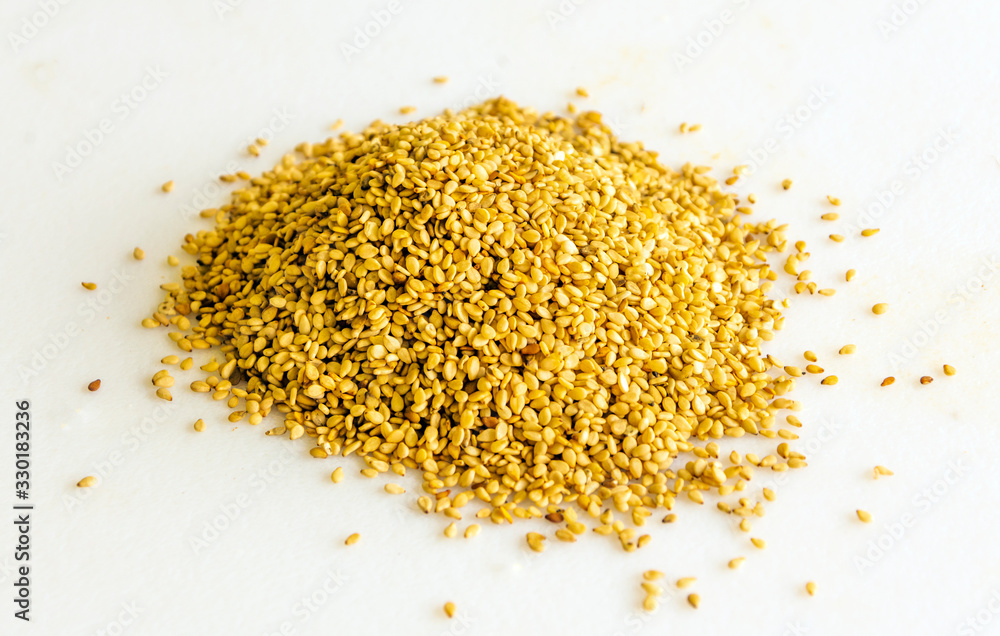 Many sesame seeds surrounded by white background Many sesame seeds surrounded by white background