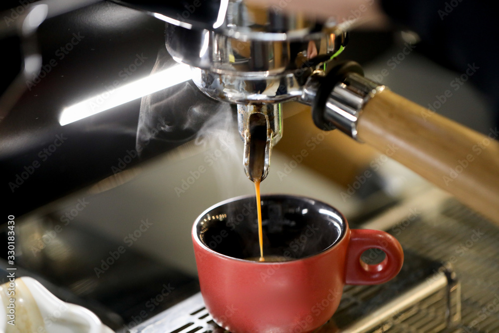 detail of espresso machine making coffee detail of espresso machine making coffee