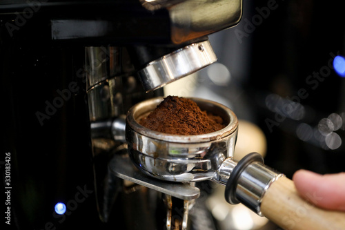close up of coffee grinding machine