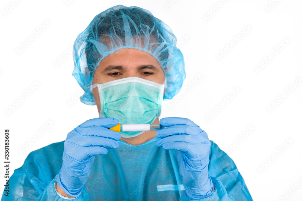 Young doctor in uniform whit protective face mask and protective gloves heck the blood sample Young doctor in uniform whit protective face mask and protective gloves heck the blood sample