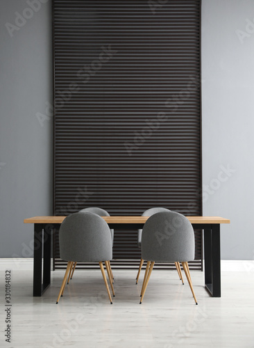 Fototapeta Naklejka Na Ścianę i Meble -  Table and chairs in room. Stylish interior design