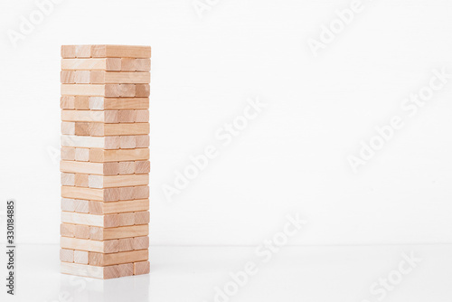 Jenga game. Wooden block on white background. photo