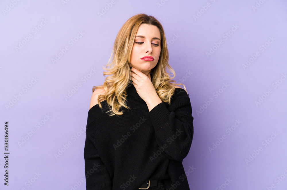 Young blonde woman isolated suffers pain in throat due a virus or infection. Young blonde woman isolated suffers pain in throat due a virus or infection.