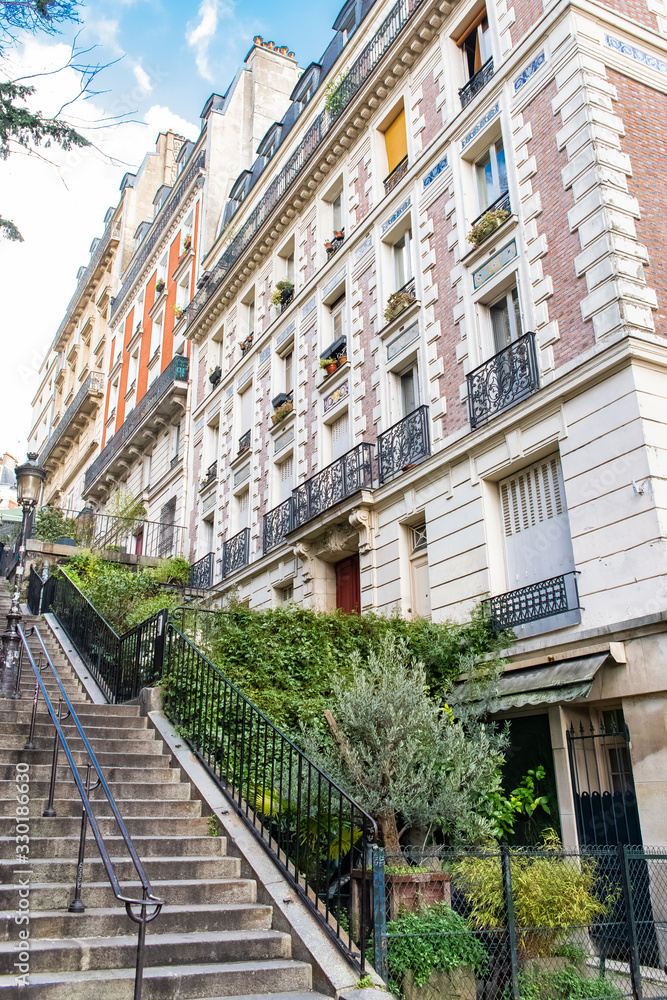 Paris, romantic staircase in Montmartre, typical buildings