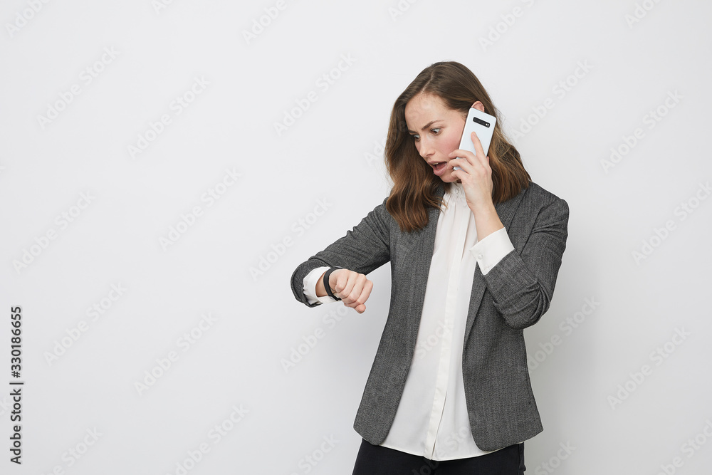 Businesswoman is stressed while talking on the phone Businesswoman is stressed while talking on the phone