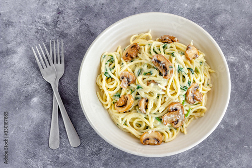 Vegan Mushroom Spinach Spaghetti Pasta on Gray Background, Top View, Vegan Food Photography