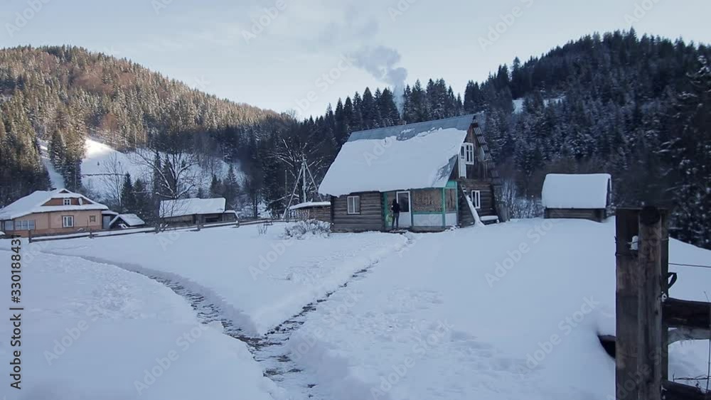 Dreamlike winter scenery - cozy solitary log hut with smoking Dreamlike winter scenery - cozy solitary log hut with smoking