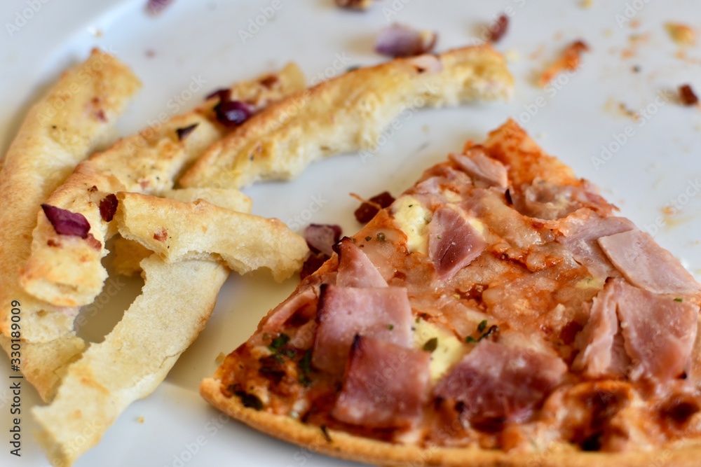 slice of pizza with some crusts slice of pizza with some crusts