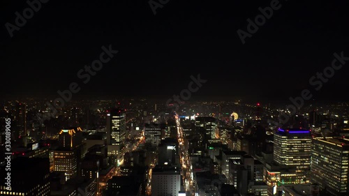 Wallpaper Mural SAPPORO, HOKKAIDO, JAPAN - FEB 2020 : Aerial high angle sunrise view of cityscape of Sapporo city. View of buildings and street traffic around Susukino downtown area. Time lapse shot night to morning. Torontodigital.ca