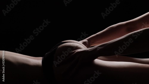 Massage priests close-up on a black background. Slow motion. photo