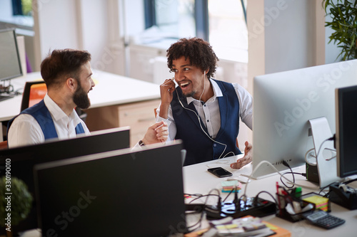 Wallpaper Mural Businessman listening music in office. Men working on project and listening to music. Torontodigital.ca