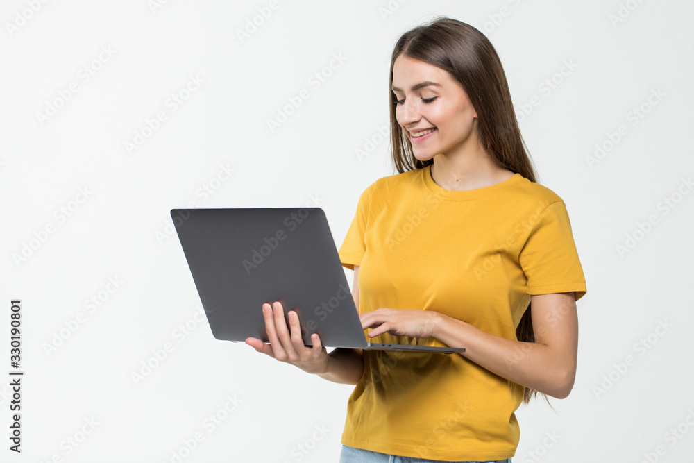 Portrait of a happy woman working on laptop computer isolated over white background Portrait of a happy woman working on laptop computer isolated over white background